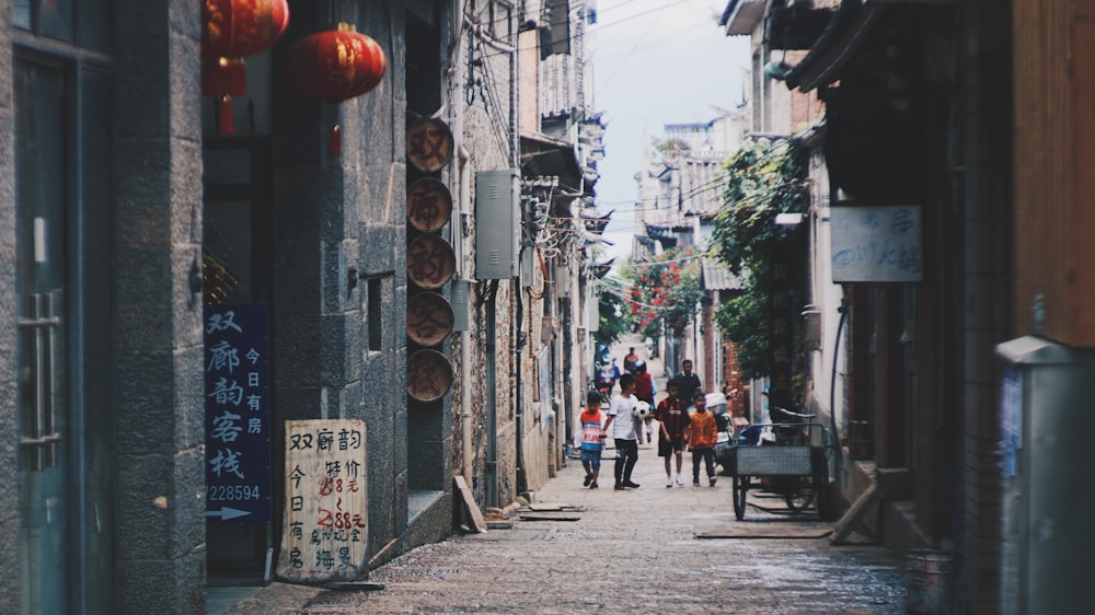 people walking on sidewalk during daytime