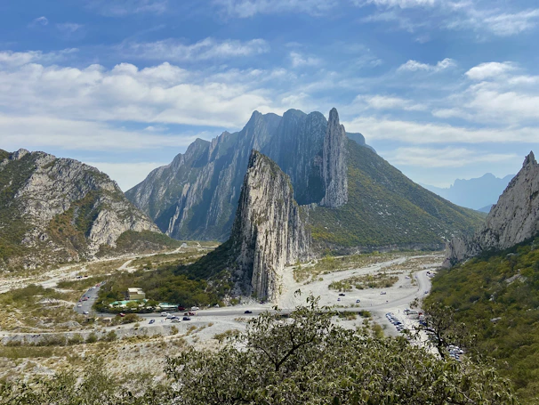 green and brown mountain under white clouds during daytime