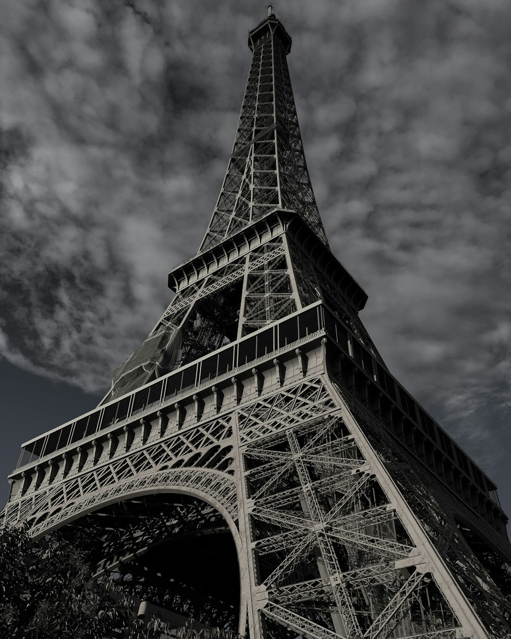 eiffel tower under gray cloudy sky