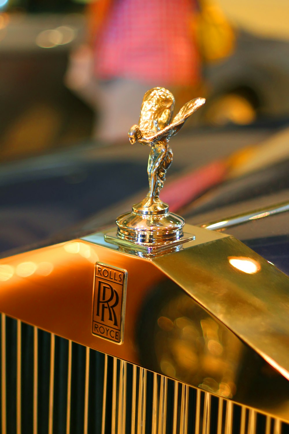 gold and black car hood ornament