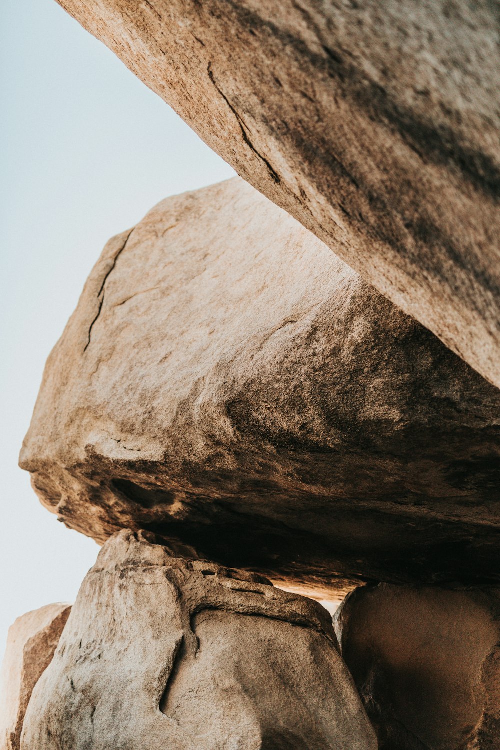 brown rock formation under white sky during daytime