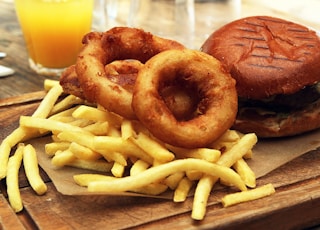 burger and fries on black table