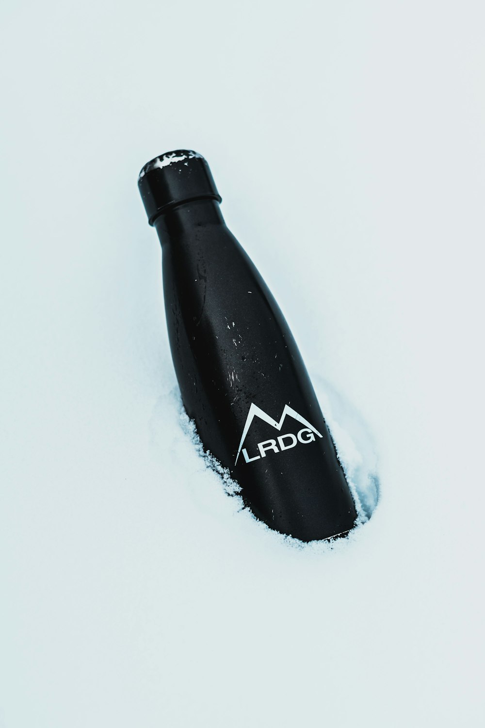 black and white UNK bottle