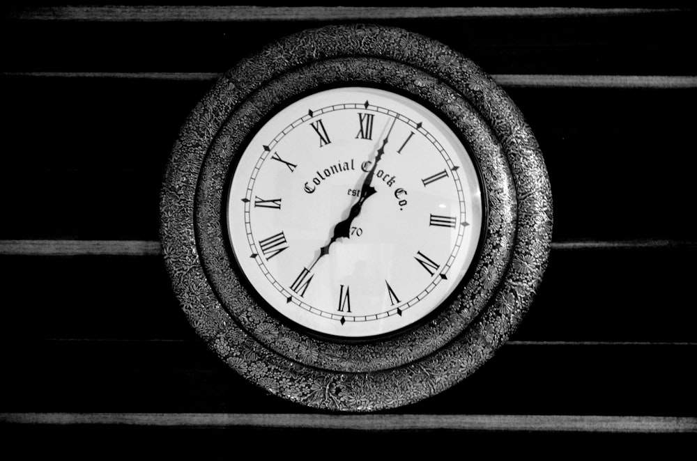 black round analog wall clock