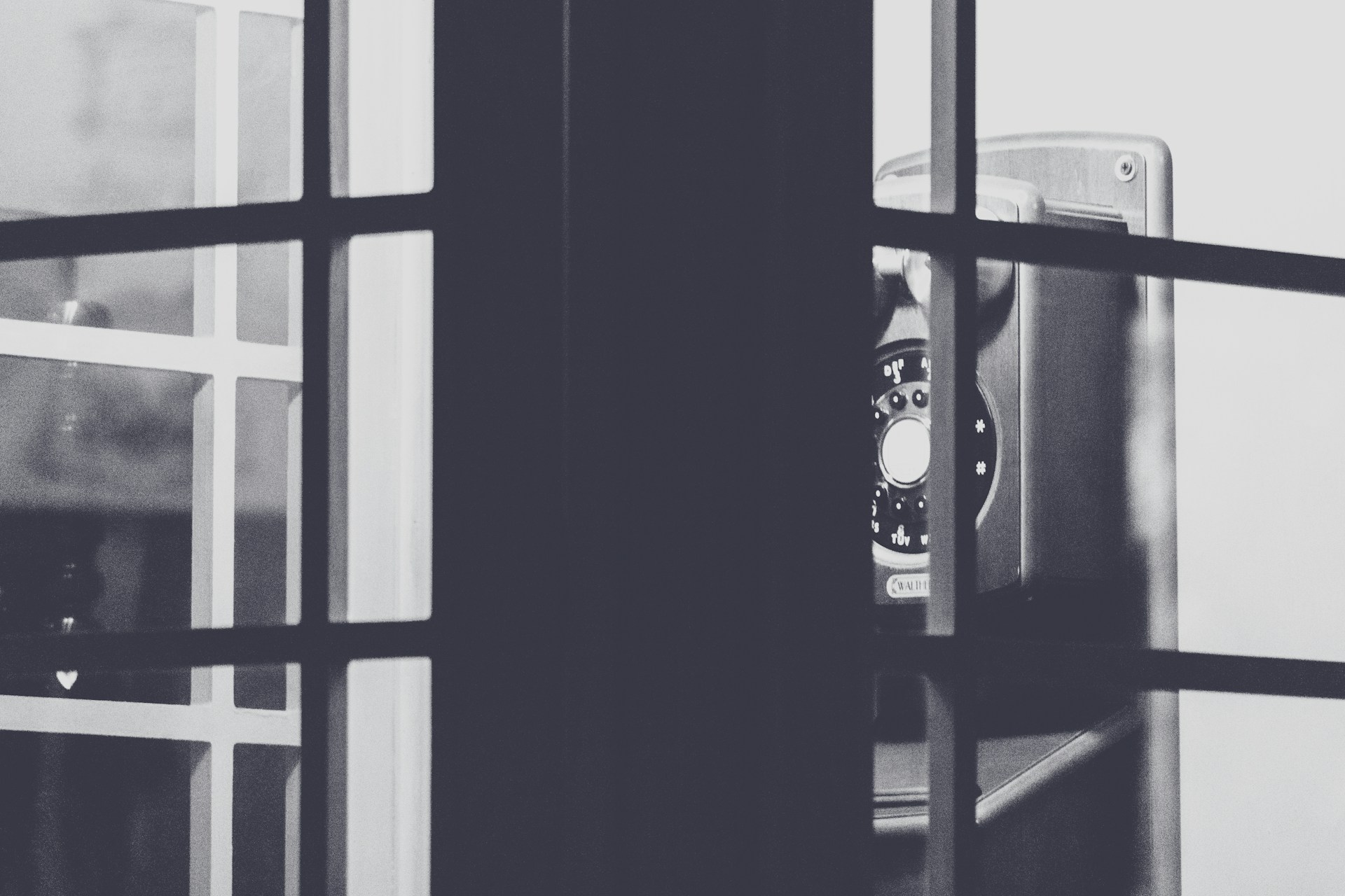 black and silver speaker beside window
