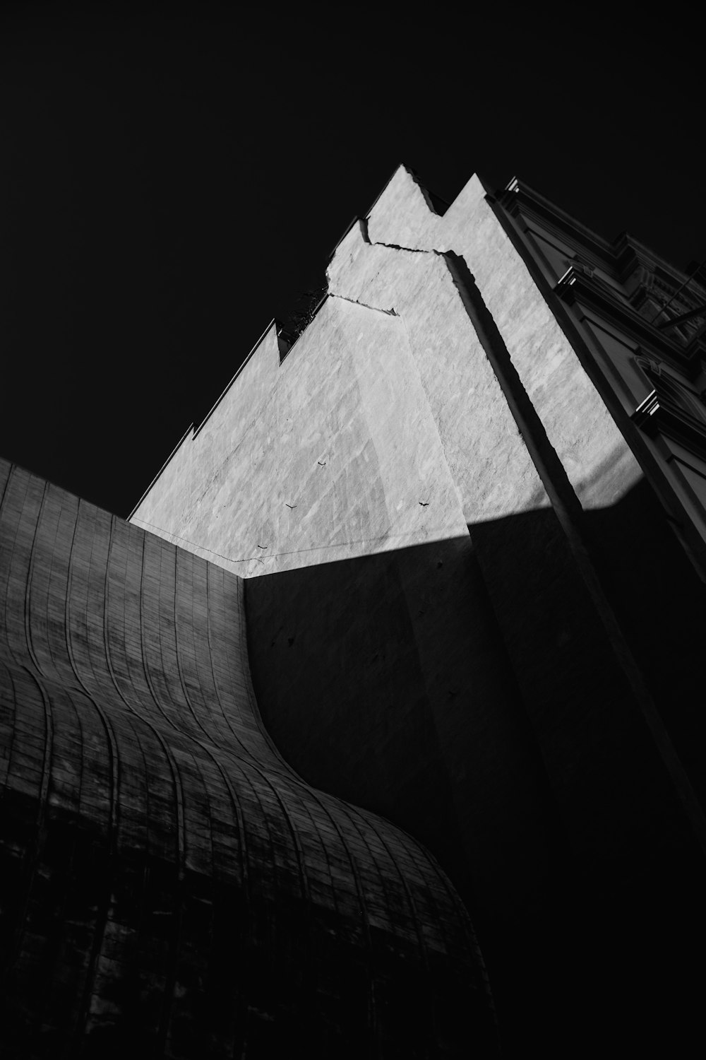 grayscale photo of concrete building