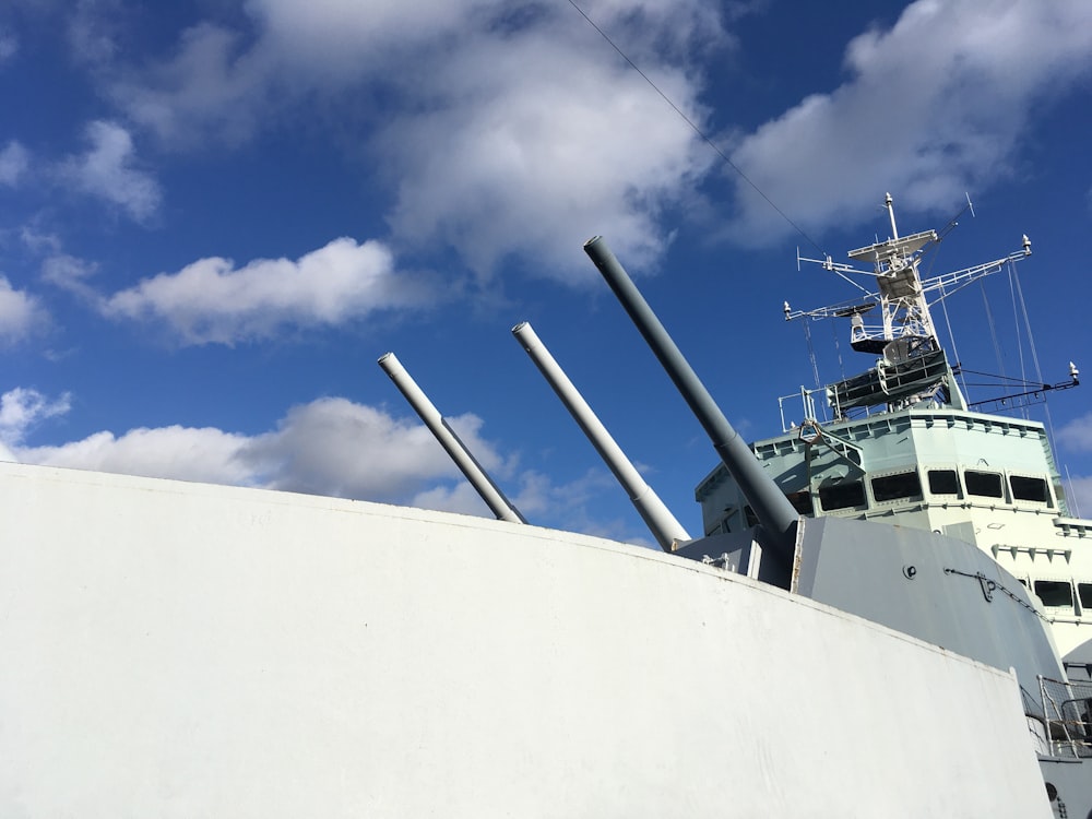 white ship on sea under blue sky during daytime