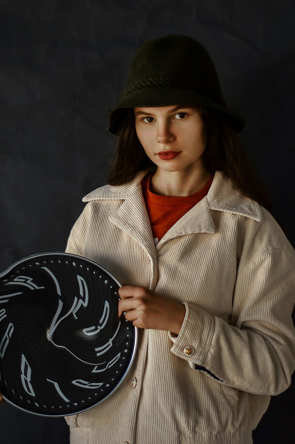 woman in black hat and brown coat