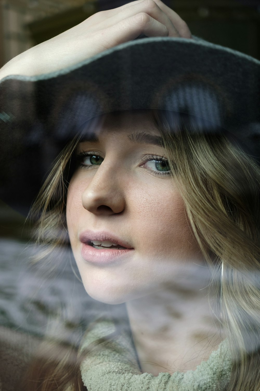 woman in black hat looking at the right side