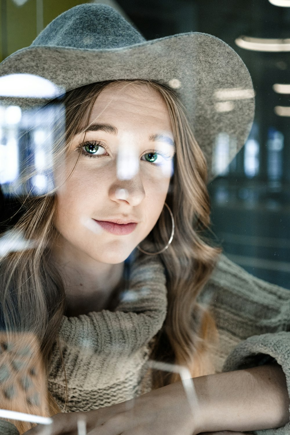 woman in gray knit sweater