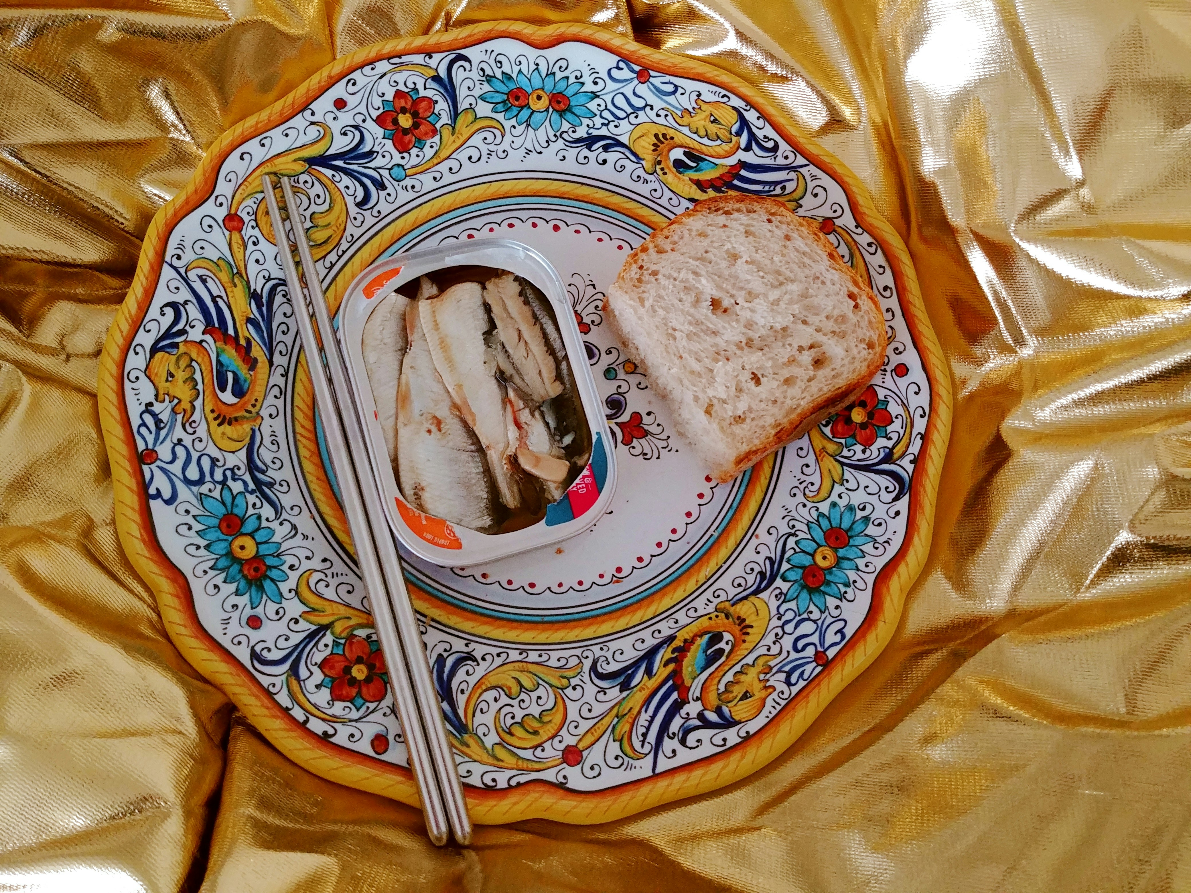 bread on white and blue floral ceramic plate