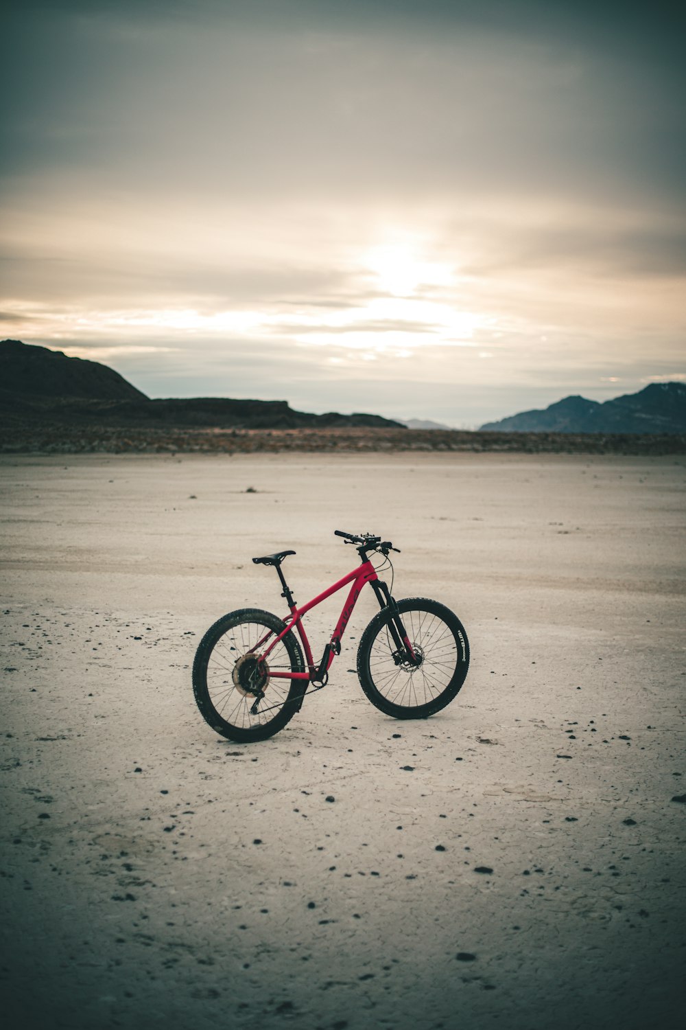 black and red mountain bike on beach shore during daytime