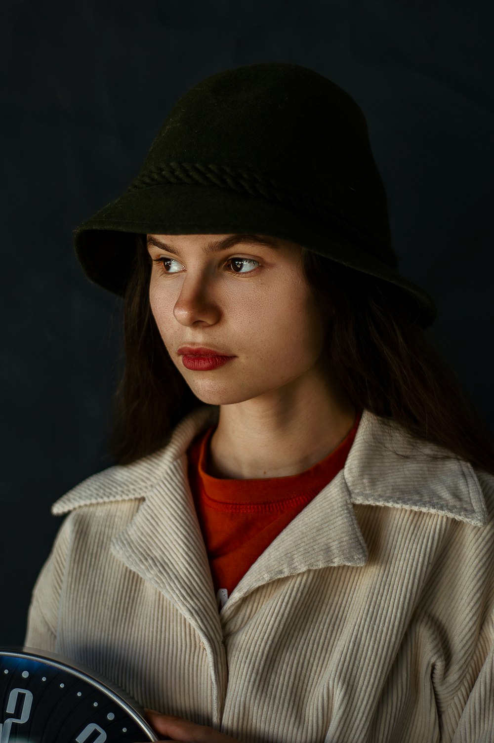 woman in black hat and white coat