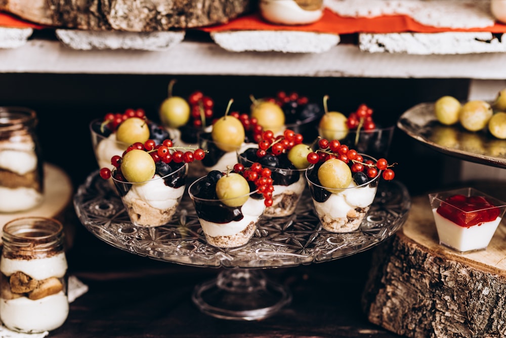 white and red fruit on clear glass bowl