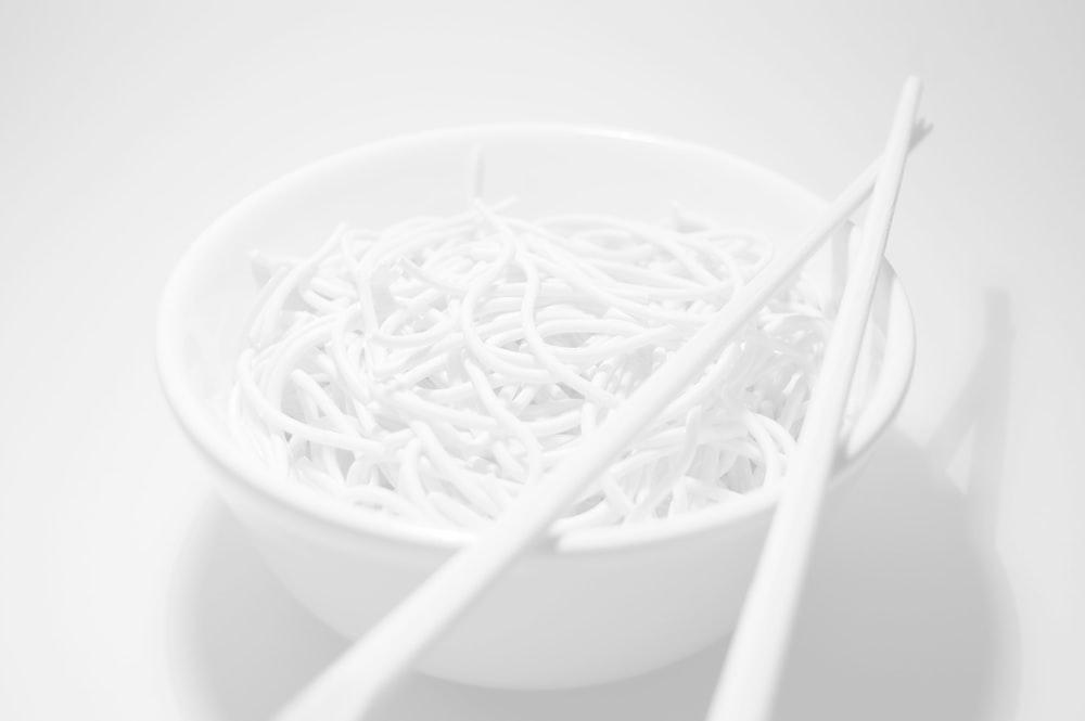 white plastic fork on white ceramic bowl