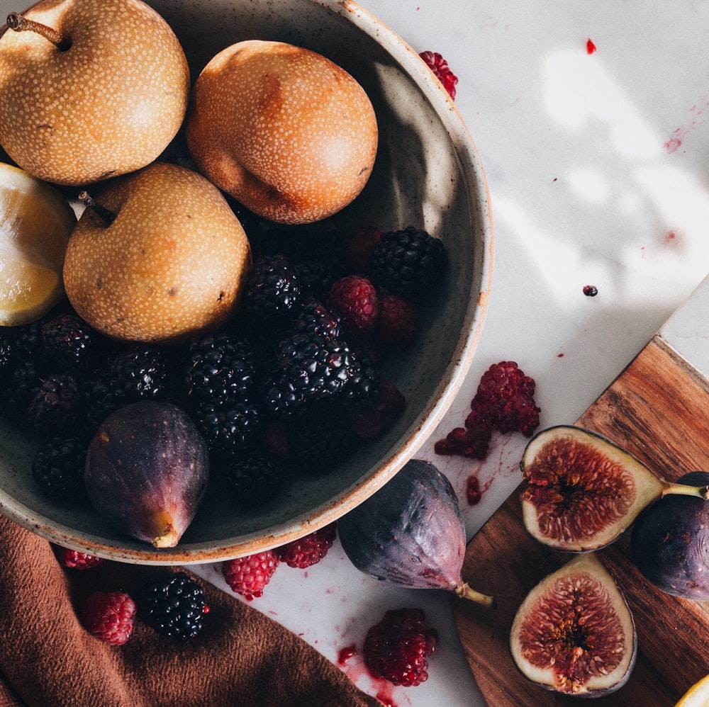 sliced fruit on stainless steel bowl