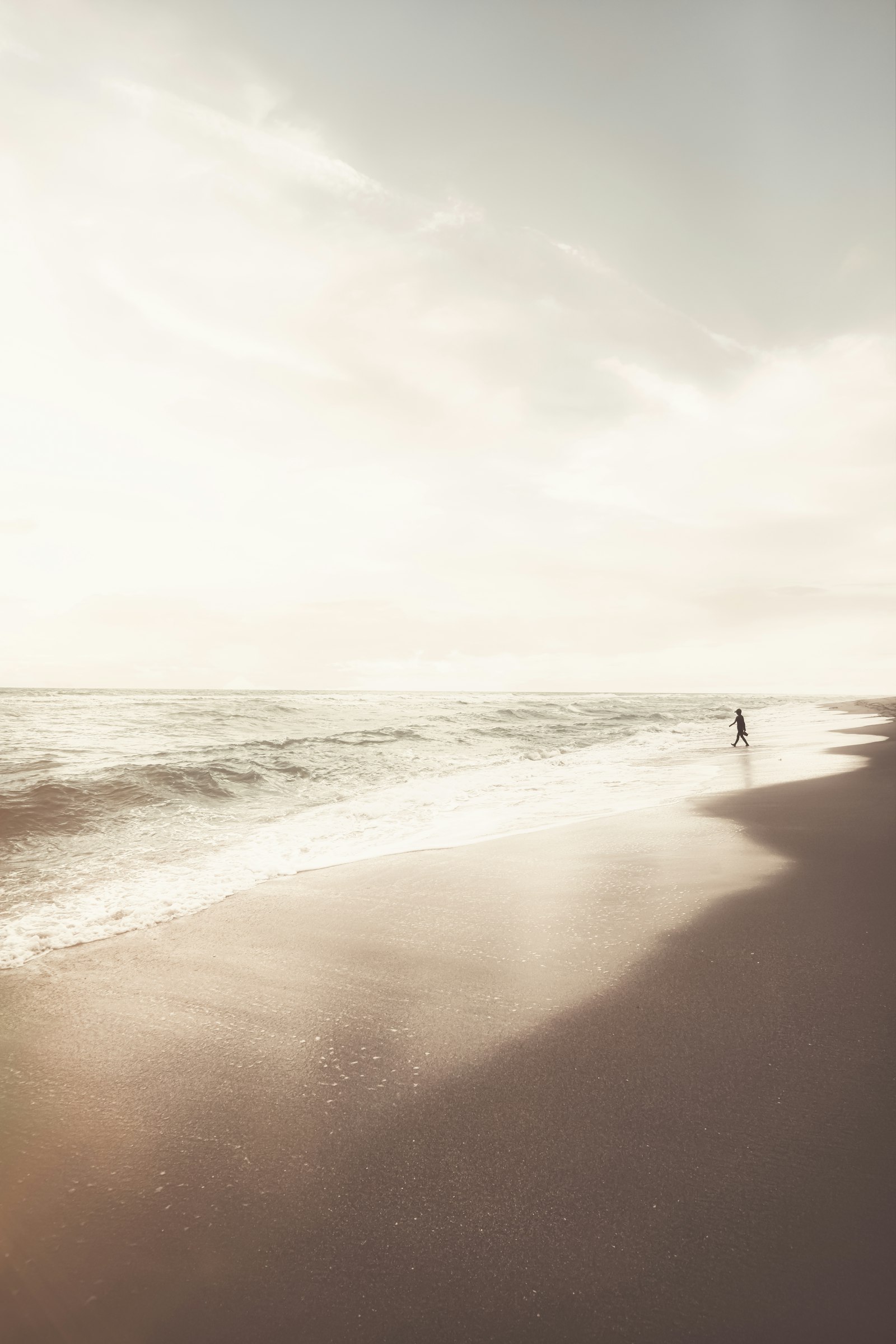 Sony a7R II + Tamron 17-28mm F2.8 Di III RXD sample photo. Person walking on beach photography