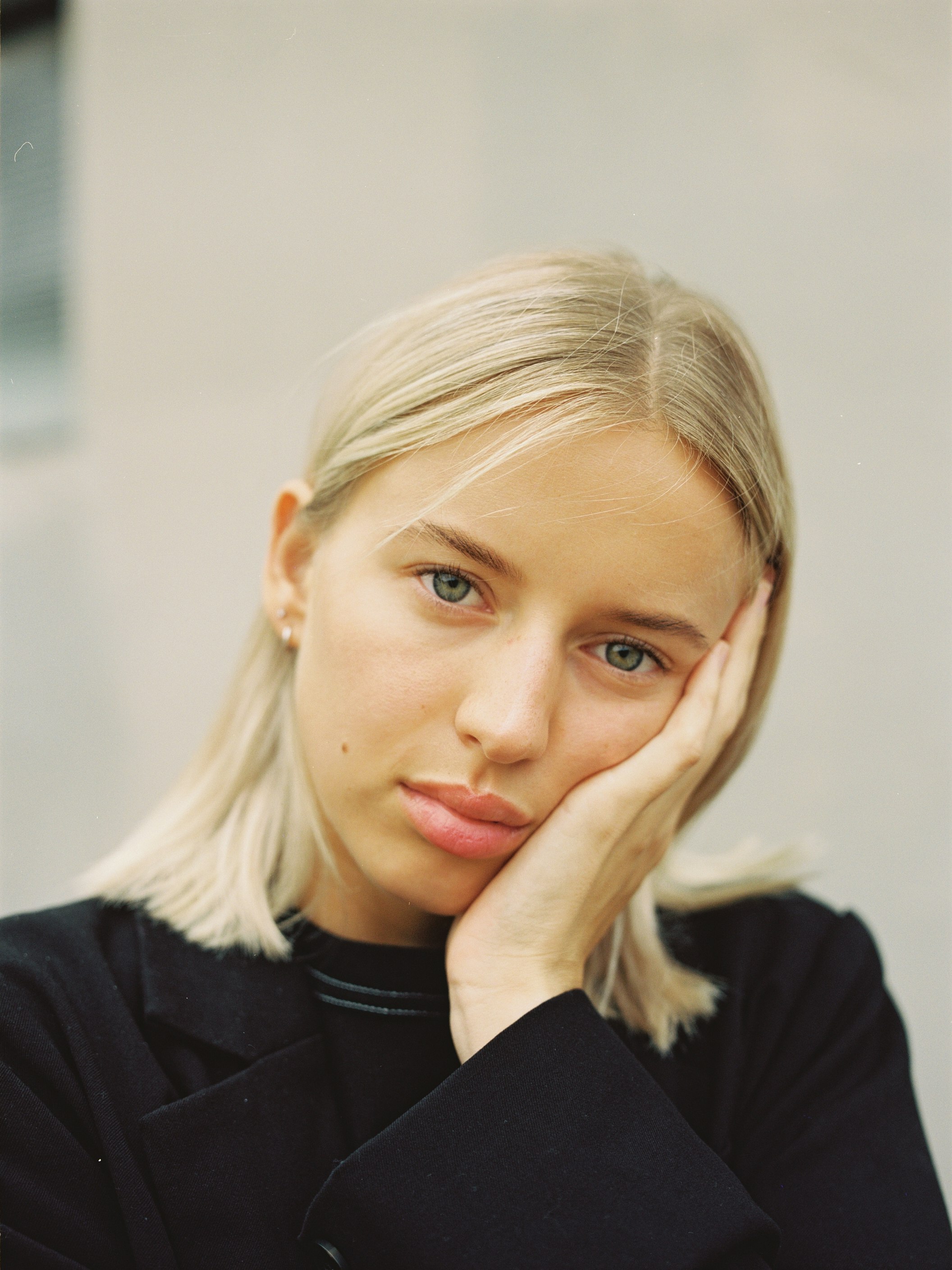 blonde woman in black shirt