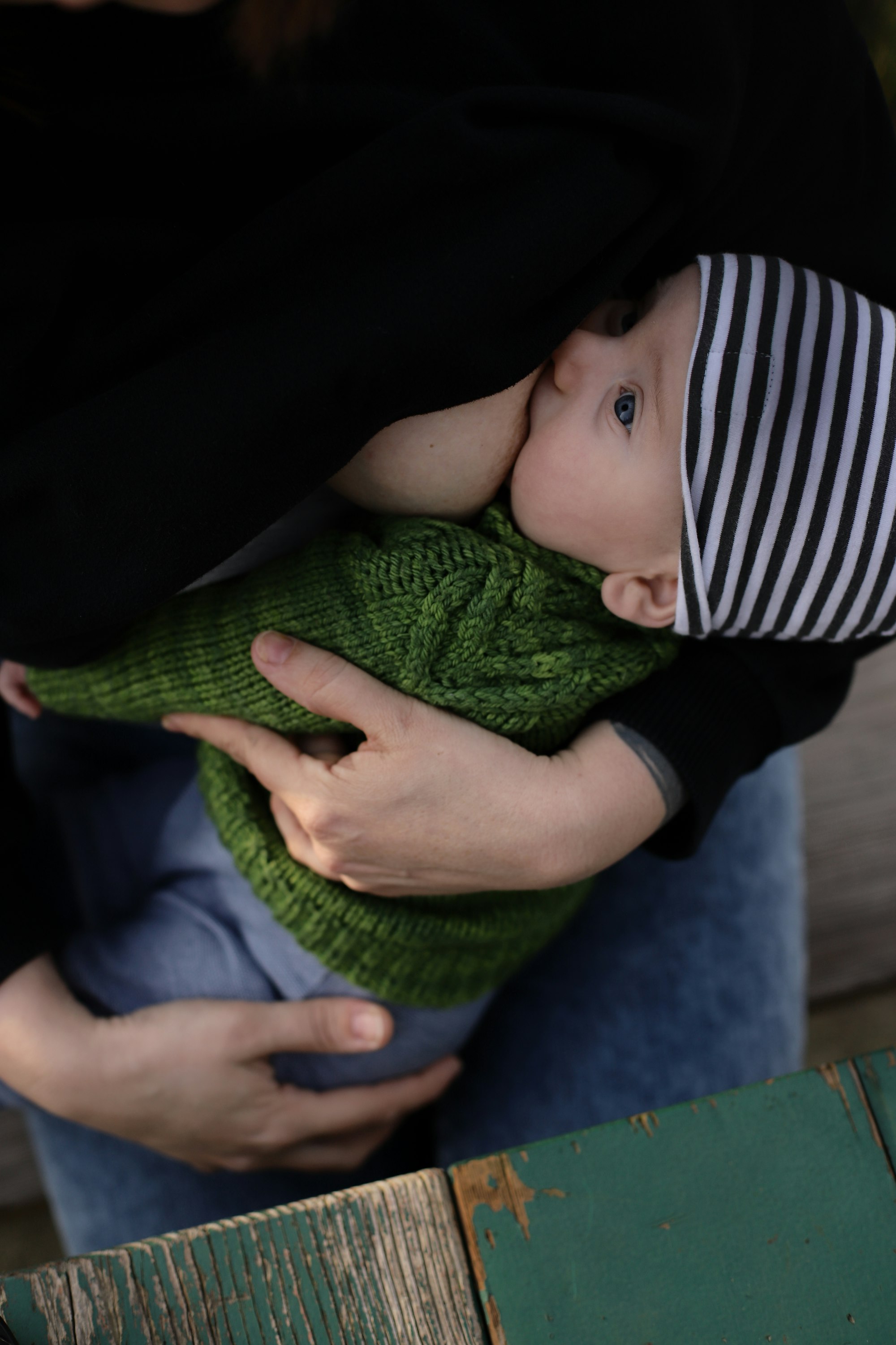 Picnics at the park.baby holding boob, baby breastfeeding, comfort nursing