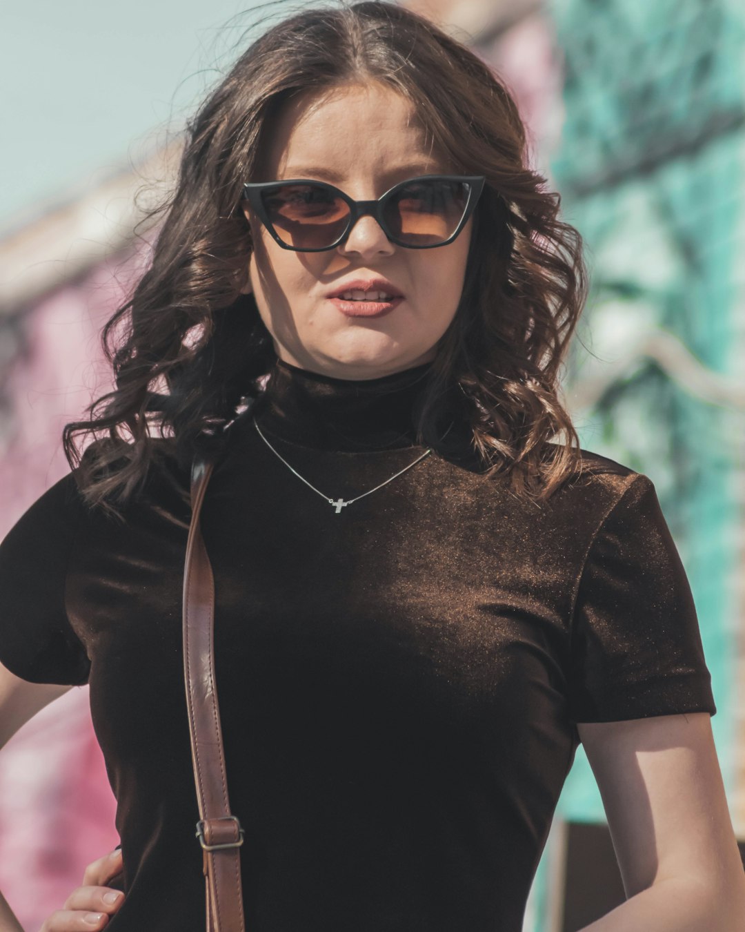 woman in black crew neck t-shirt wearing brown sunglasses