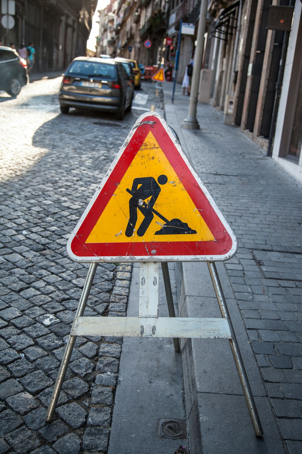 yellow and black road sign