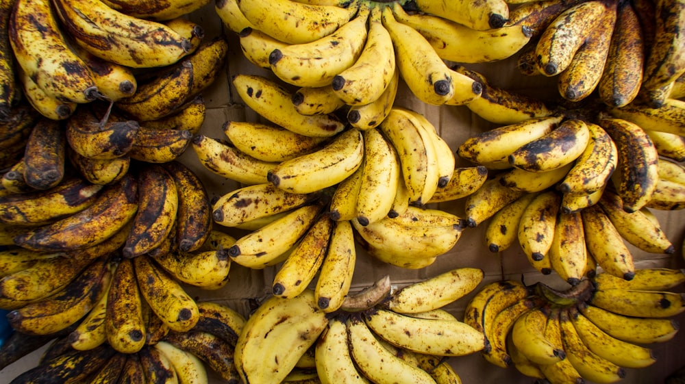 yellow banana fruit on white table