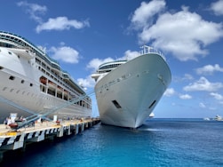 white ship on sea under blue sky during daytime