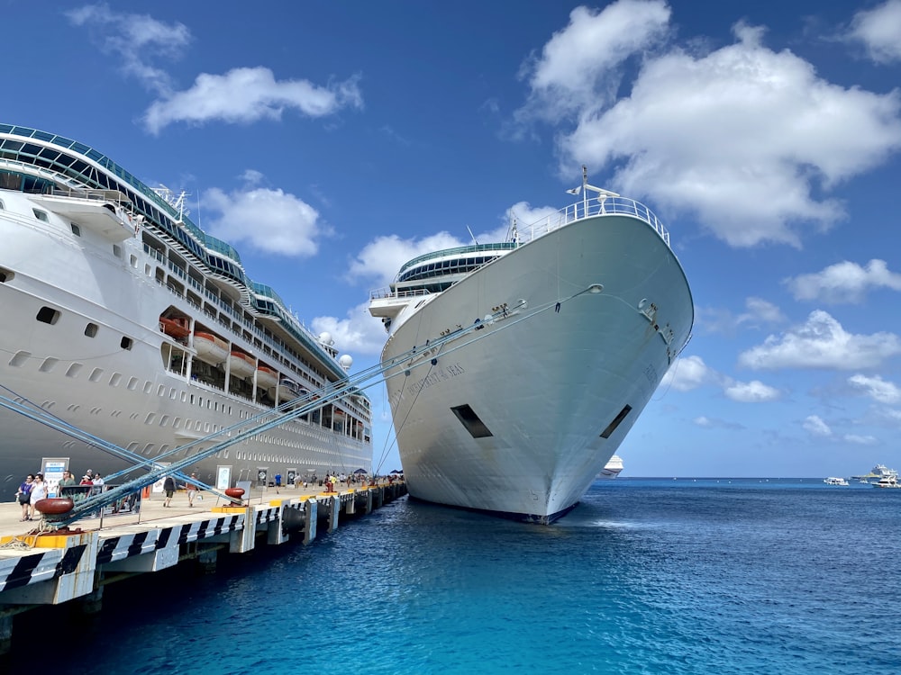 white ship on sea under blue sky during daytime