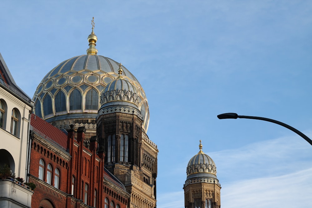 brown and white dome building under blue sky during daytime