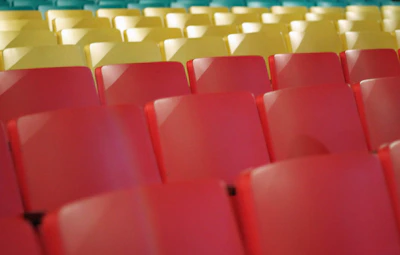 red plastic chairs in stadium