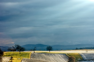 A peaceful white landscape under a cloudy sky, evoking calm.
