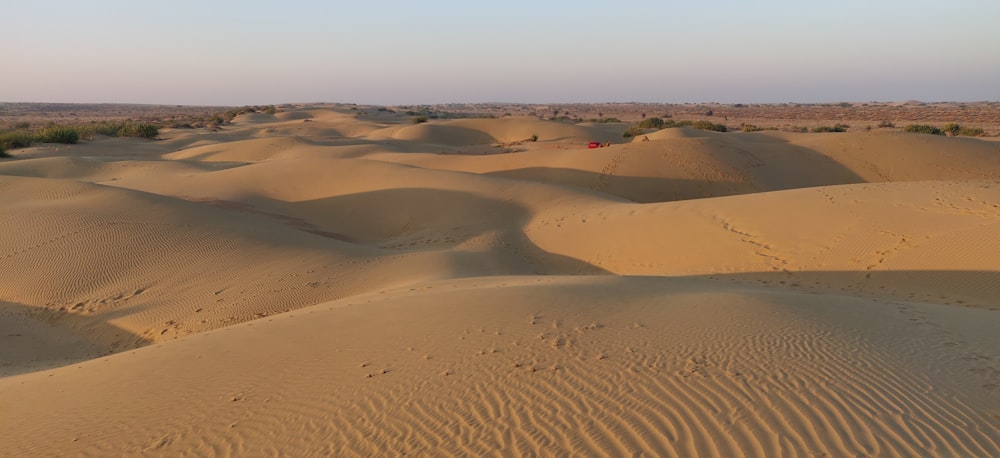 brown sand under blue sky during daytime