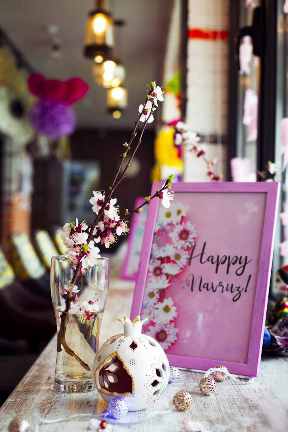 pink and white flowers in clear glass vase