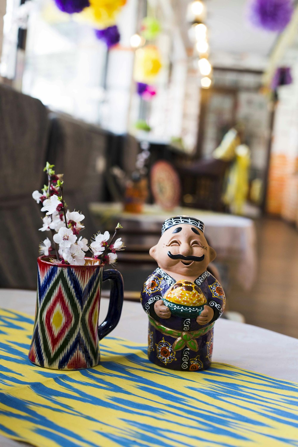 brown and blue ceramic figurine