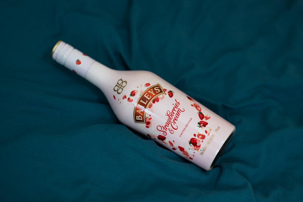 white and red labeled bottle
