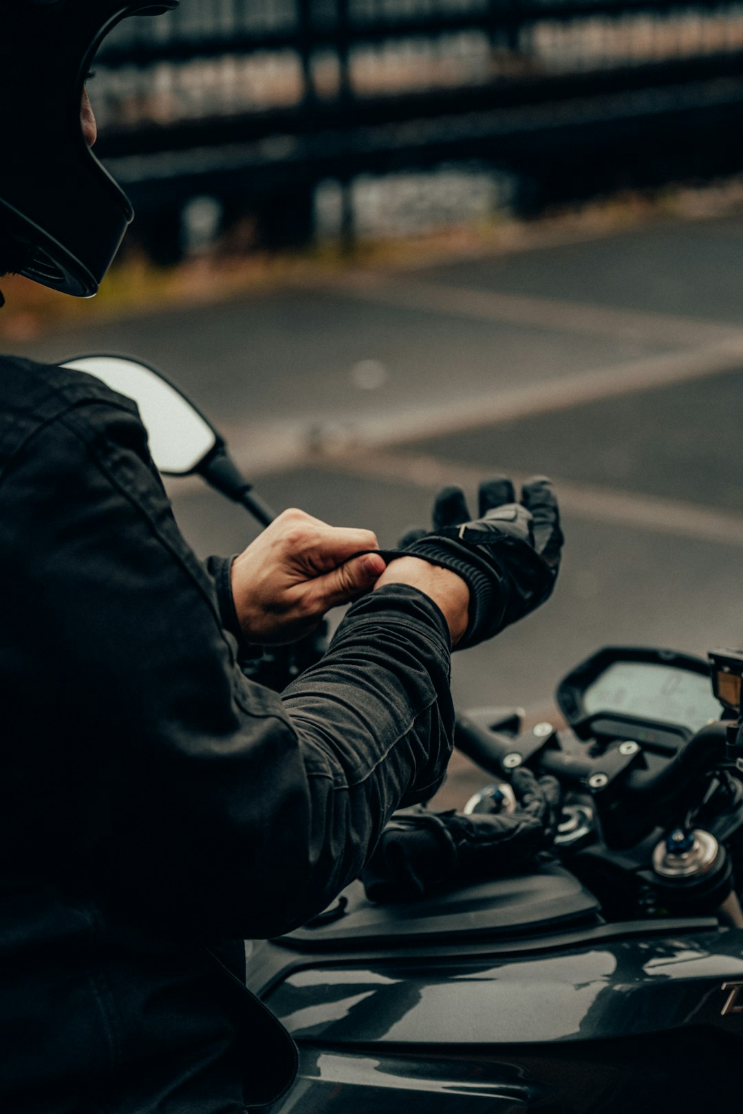 person in black jacket driving motorcycle