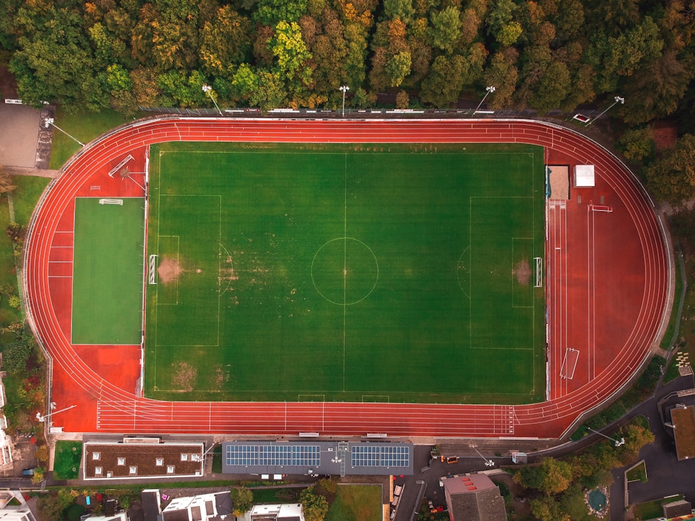 aerial view of green and red soccer field