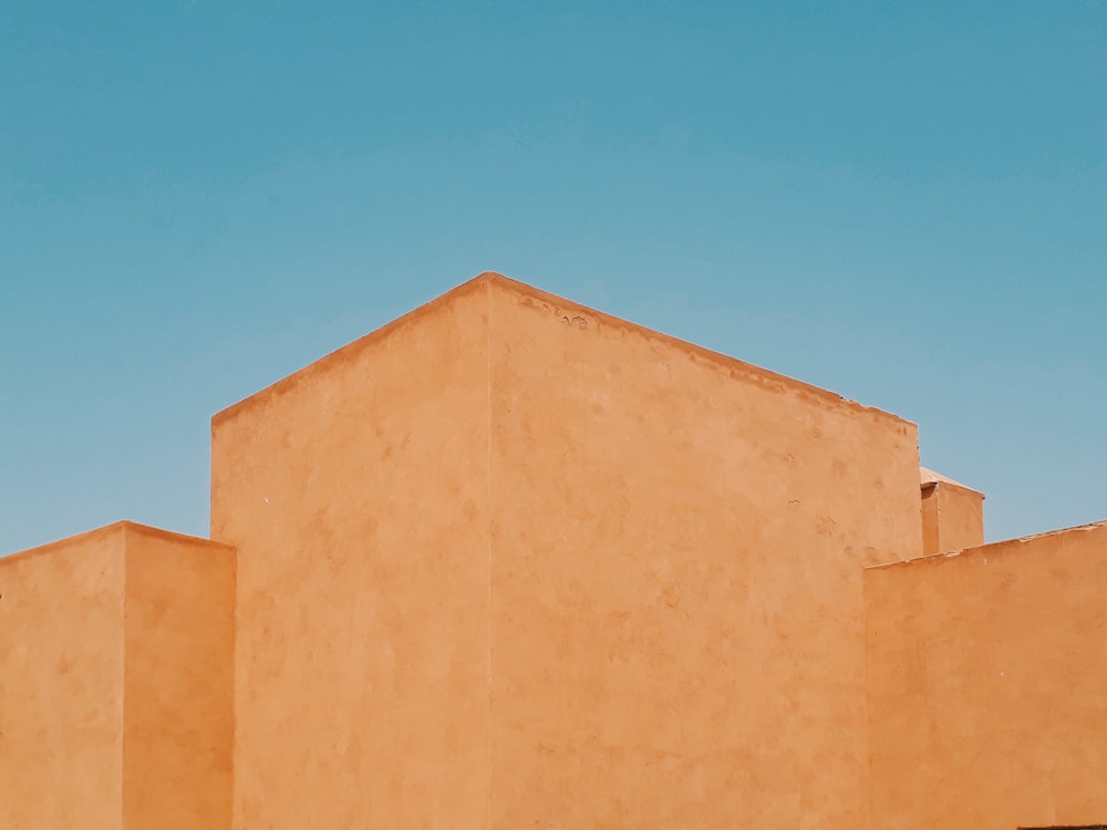 brown concrete building under blue sky during daytime