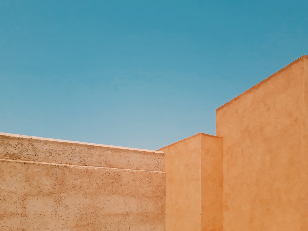 brown concrete building under blue sky during daytime