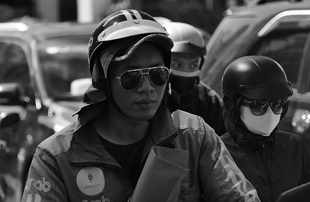 grayscale photo of man wearing sunglasses and helmet