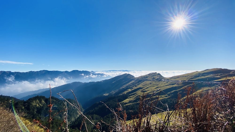 green mountains under blue sky during daytime