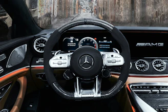 black and silver mercedes benz steering wheel