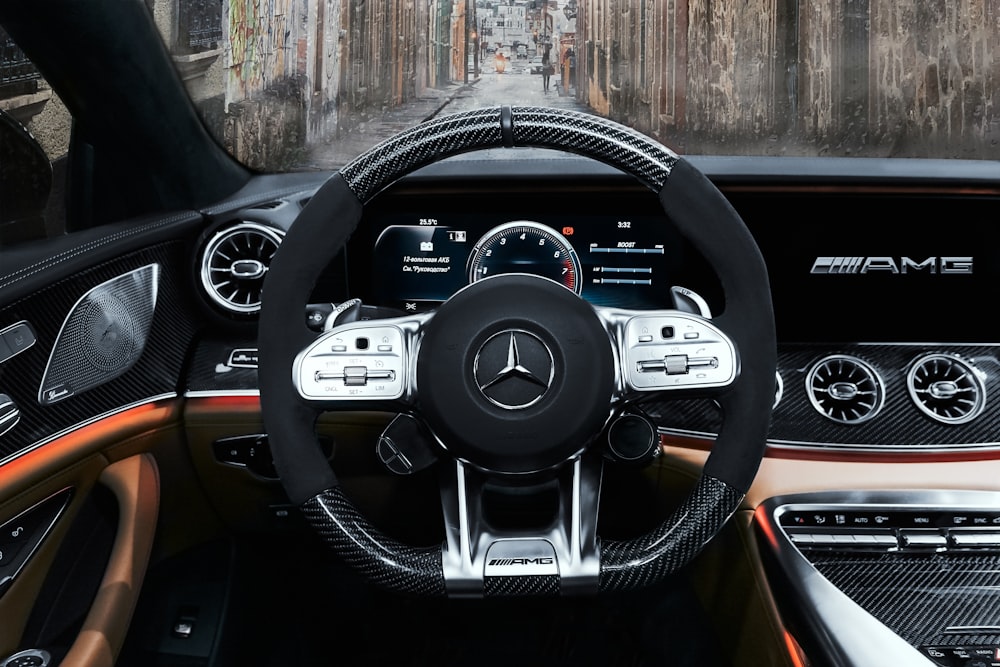 black and silver mercedes benz steering wheel