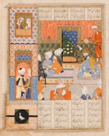 An intricately detailed Persian miniature painting depicting a group of people in traditional attire within an ornately decorated interior. The walls feature a combination of geometric patterns and floral motifs, all in vibrant colors. The scene is set within a palace or royal court, where several individuals are seated and standing, engaged in various activities or dialogue. A framed painting with bird motifs is present, enhancing the rich decorative elements of the setting.