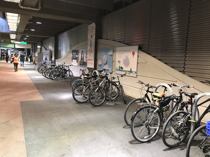 A row of neatly parked bicycles in a secure area.