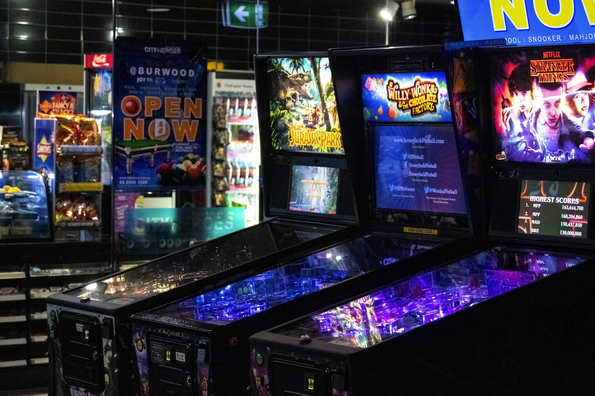 arcade game machine turned on in a room