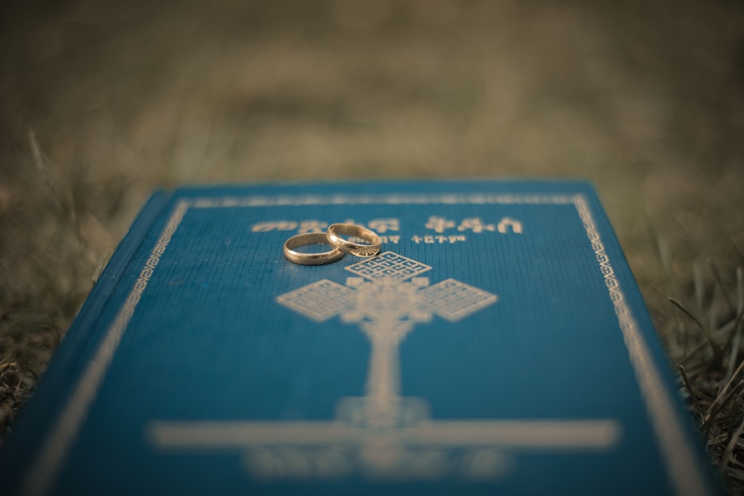 blue and gold cross on blue and brown wooden board