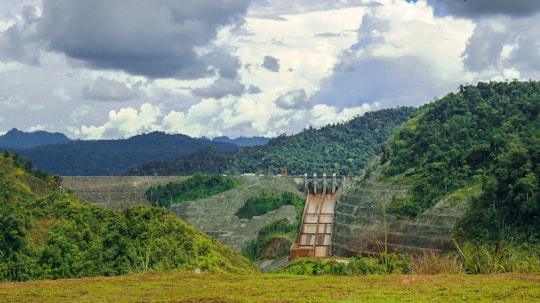 green trees on mountain under white clouds during daytime in Bakun Malaysia