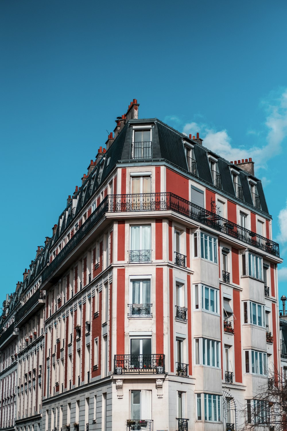 red and white concrete building under blue sky during daytime