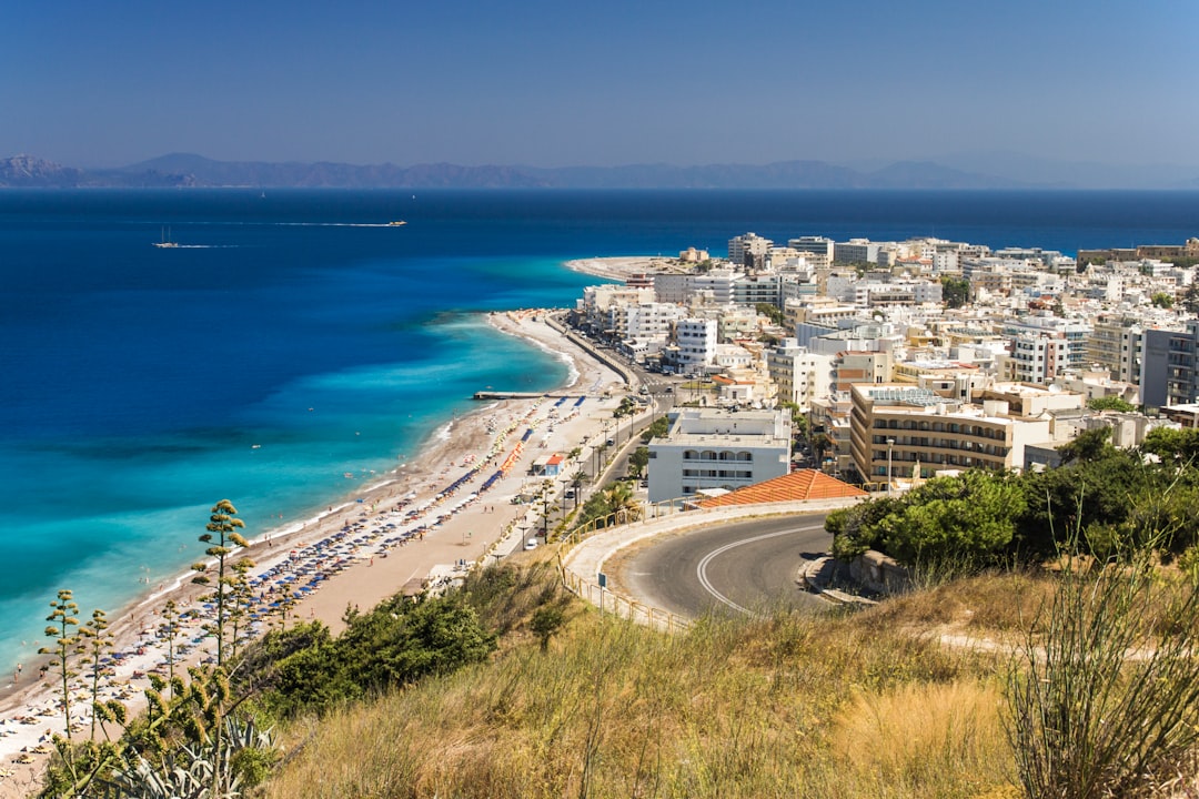 aerial view of city buildings near sea during daytime